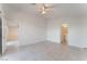 Spacious bedroom with tile floors, access to bathroom and other rooms at 402 Dune Ridge Ave, North Las Vegas, NV 89031