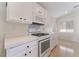 Clean kitchen with white cabinets and quartz countertops at 402 Dune Ridge Ave, North Las Vegas, NV 89031