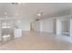 Open and airy living area with tile floors and ceiling fan at 402 Dune Ridge Ave, North Las Vegas, NV 89031