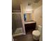 Bathroom with shower, granite vanity, and toilet at 4965 Indian River Dr # 103, Las Vegas, NV 89103