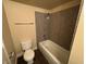 Clean bathroom with a shower/tub combo and granite-tiled walls at 4965 Indian River Dr # 103, Las Vegas, NV 89103