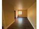 Bright bedroom with dark laminate floors and a large closet at 4965 Indian River Dr # 103, Las Vegas, NV 89103