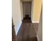 Hallway with dark brown wood-look flooring at 4965 Indian River Dr # 103, Las Vegas, NV 89103