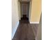 Hallway with dark brown wood-look flooring at 4965 Indian River Dr # 103, Las Vegas, NV 89103