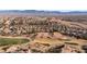 Aerial view showcasing home's location in a mountainous golf course community at 497 Fairways Dr, Mesquite, NV 89027