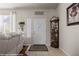 Bright and airy entryway with hardwood floors and a decorative curio cabinet at 497 Fairways Dr, Mesquite, NV 89027