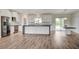 Modern kitchen with white cabinets, large island and stainless steel appliances at 5500 Santovito St, Pahrump, NV 89061