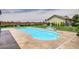 Freeform swimming pool with surrounding stone patio at 5500 Santovito St, Pahrump, NV 89061