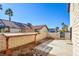 Private patio area with block wall and gravel at 608 Sea Pines Ln, Las Vegas, NV 89107