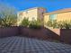 Private backyard with checkerboard patio and wall at 6538 Creekside Cellars Ct, Las Vegas, NV 89139