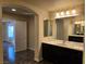 Double sink bathroom with large mirror and walk-in shower at 6538 Creekside Cellars Ct, Las Vegas, NV 89139