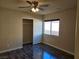 Bedroom with hardwood floors, ceiling fan, and closet at 6538 Creekside Cellars Ct, Las Vegas, NV 89139