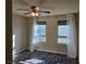 Bright bedroom with hardwood floors, ceiling fan, and dual windows at 6538 Creekside Cellars Ct, Las Vegas, NV 89139