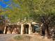 Two-story house with a three-car garage and mature trees at 6538 Creekside Cellars Ct, Las Vegas, NV 89139