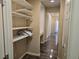 Hallway with linen closet and wood-look flooring at 6538 Creekside Cellars Ct, Las Vegas, NV 89139