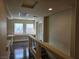 Upper hallway with hardwood floors and built-in window seat at 6538 Creekside Cellars Ct, Las Vegas, NV 89139