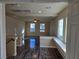 Bright living room with hardwood floors and built-in window seat at 6538 Creekside Cellars Ct, Las Vegas, NV 89139