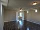 Large living room with hardwood floors and built-in window seat at 6538 Creekside Cellars Ct, Las Vegas, NV 89139