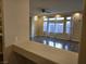 Bright living room with hardwood floors and large windows at 6538 Creekside Cellars Ct, Las Vegas, NV 89139