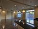 Spacious living area with hardwood floors and large windows at 6538 Creekside Cellars Ct, Las Vegas, NV 89139