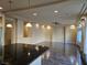 Bright living room features hardwood floors and a ceiling fan at 6538 Creekside Cellars Ct, Las Vegas, NV 89139