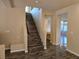 Modern staircase with dark wood and a metal railing at 6538 Creekside Cellars Ct, Las Vegas, NV 89139