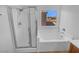 Clean bathroom with shower and bathtub at 7100 Estrella De Mar Ave, Las Vegas, NV 89131