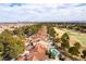 Sprawling aerial shot showing the neighborhood's close proximity to the golf course and Las Vegas skyline at 7909 Rio Rico Dr, Las Vegas, NV 89113