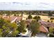 Aerial view of the property showcasing the tile roof and surrounding golf course community at 7909 Rio Rico Dr, Las Vegas, NV 89113