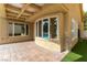 Home's backyard patio with brick flooring and access to the pool at 7909 Rio Rico Dr, Las Vegas, NV 89113