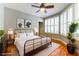 Staged bedroom showcasing hardwood floors, ceiling fan, and modern decor at 7909 Rio Rico Dr, Las Vegas, NV 89113