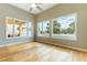 Bright bedroom with hardwood floors and views of the pool at 7909 Rio Rico Dr, Las Vegas, NV 89113