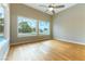 Bright bedroom with hardwood floors and backyard views at 7909 Rio Rico Dr, Las Vegas, NV 89113