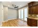 Bright breakfast nook featuring wood floors, light-gray walls, and a French door to the backyard at 7909 Rio Rico Dr, Las Vegas, NV 89113