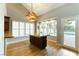 Dining area with chandelier, shutters, and view of the pool at 7909 Rio Rico Dr, Las Vegas, NV 89113