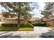 Charming single-story home with a tile roof, mature trees, and well-maintained landscaping at 7909 Rio Rico Dr, Las Vegas, NV 89113