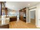 Bright kitchen features wooden cabinets, granite counters, stainless steel appliances and wood flooring at 7909 Rio Rico Dr, Las Vegas, NV 89113