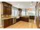 Kitchen with custom cabinets, stainless steel appliances, and stone countertops at 7909 Rio Rico Dr, Las Vegas, NV 89113