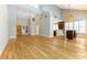 Light-filled living room featuring hardwood floors, bar area, and views of the backyard at 7909 Rio Rico Dr, Las Vegas, NV 89113