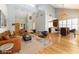 Spacious living room with leather furniture, hardwood floors, and high ceilings at 7909 Rio Rico Dr, Las Vegas, NV 89113