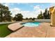 Backyard view of pool with turf and well-maintained landscaping at 7909 Rio Rico Dr, Las Vegas, NV 89113