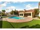 Inviting pool and brick patio create a backyard oasis perfect for relaxation and outdoor entertaining at 7909 Rio Rico Dr, Las Vegas, NV 89113