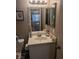Bathroom with vanity, sink, and mirror at 7964 Rim Rock Way # 102, Las Vegas, NV 89128