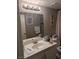 Bathroom with vanity, sink, and toilet at 7964 Rim Rock Way # 102, Las Vegas, NV 89128