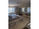 Bedroom with mirrored closet doors and seating at 7964 Rim Rock Way # 102, Las Vegas, NV 89128