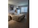 Spacious bedroom with dresser and window at 7964 Rim Rock Way # 102, Las Vegas, NV 89128