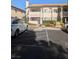 Two-story building exterior with parking and landscaping at 7964 Rim Rock Way # 102, Las Vegas, NV 89128