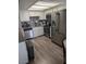 Modern kitchen features stainless steel appliances and granite countertops at 7964 Rim Rock Way # 102, Las Vegas, NV 89128
