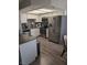 Modern kitchen features stainless steel appliances and granite countertops at 7964 Rim Rock Way # 102, Las Vegas, NV 89128