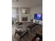 Cozy living room with a fireplace and wood flooring at 7964 Rim Rock Way # 102, Las Vegas, NV 89128